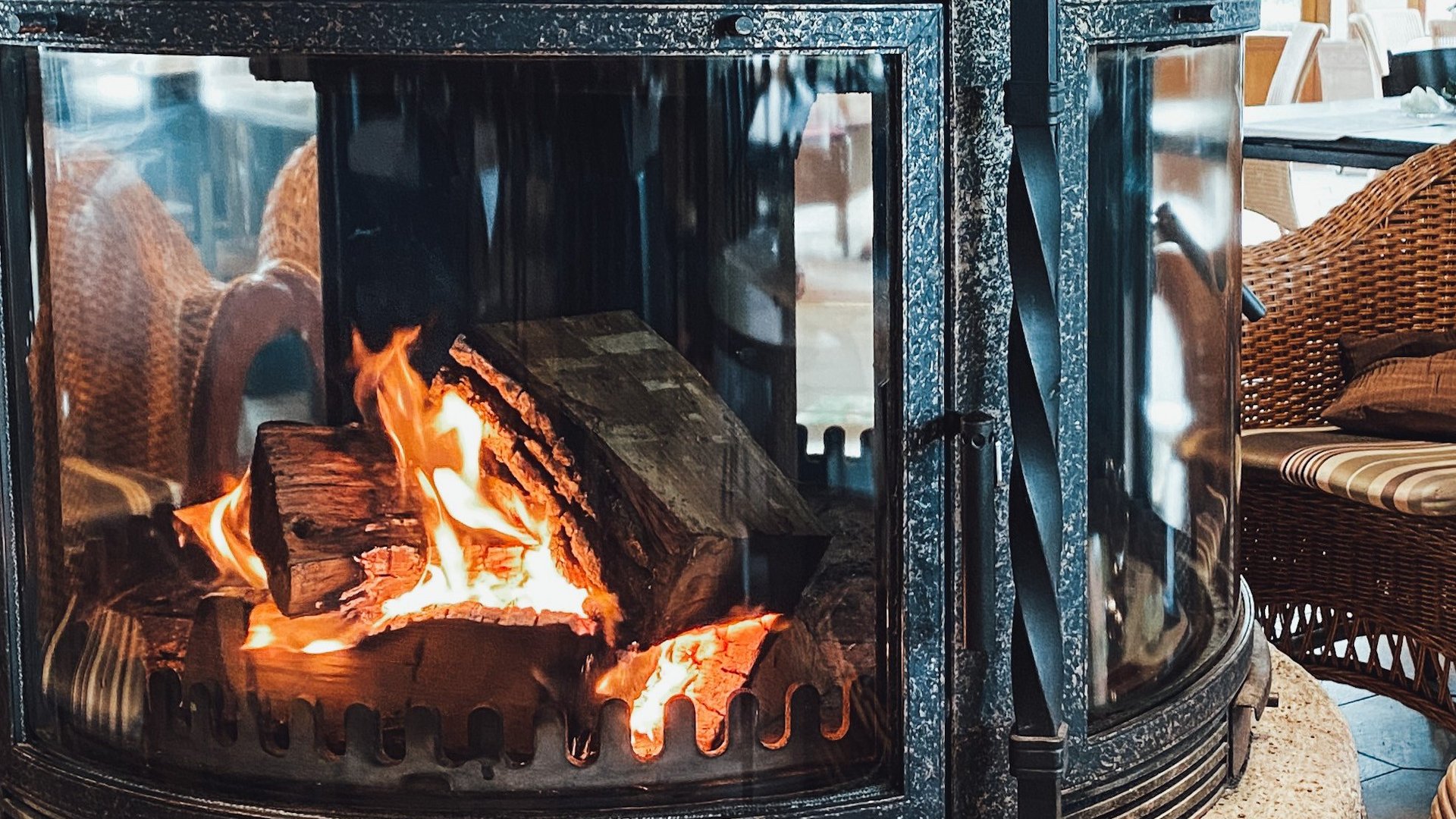 Hiking in North Rhine-Westphalia at any time of year Round fireplace with burning wood in cozy living room