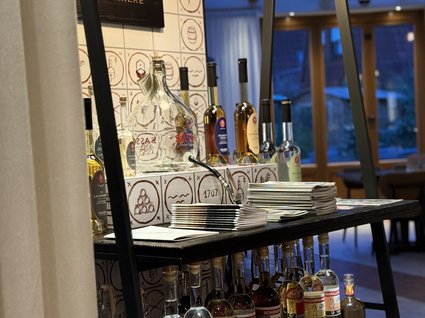 Restaurant Gronau: Seeblick Shelf displaying various liquors and spirits in a bar